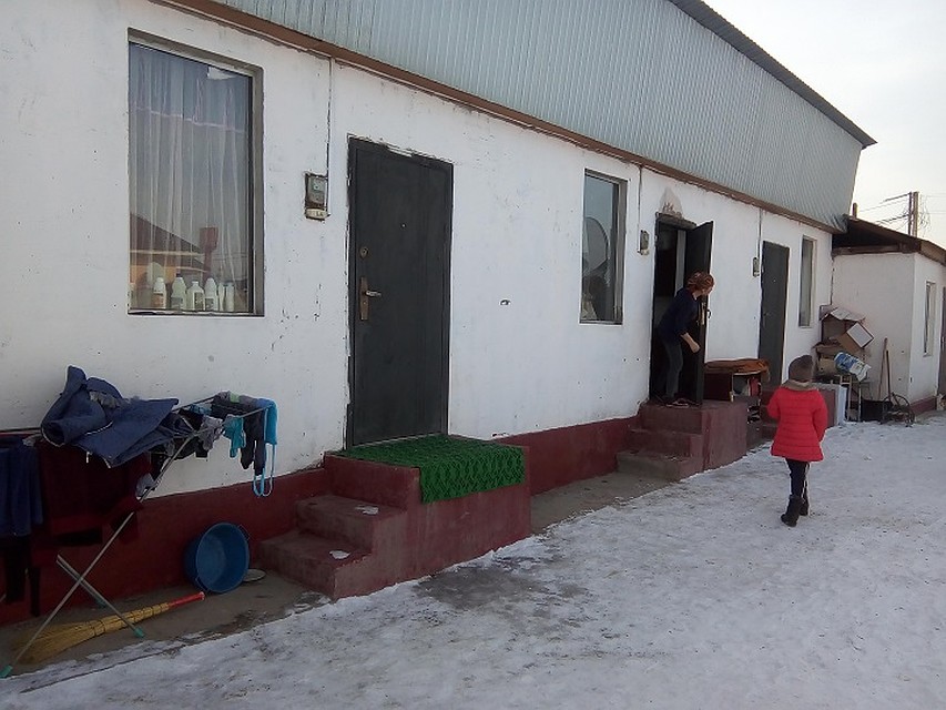 This temporary housing is shared by several families. One of these doors leads to a 6 square meters room where “movie star” lives with four children.